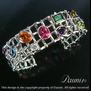 Woven 14k white gold and her gemstones.